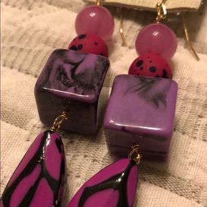 Pink and purple statement earrings.